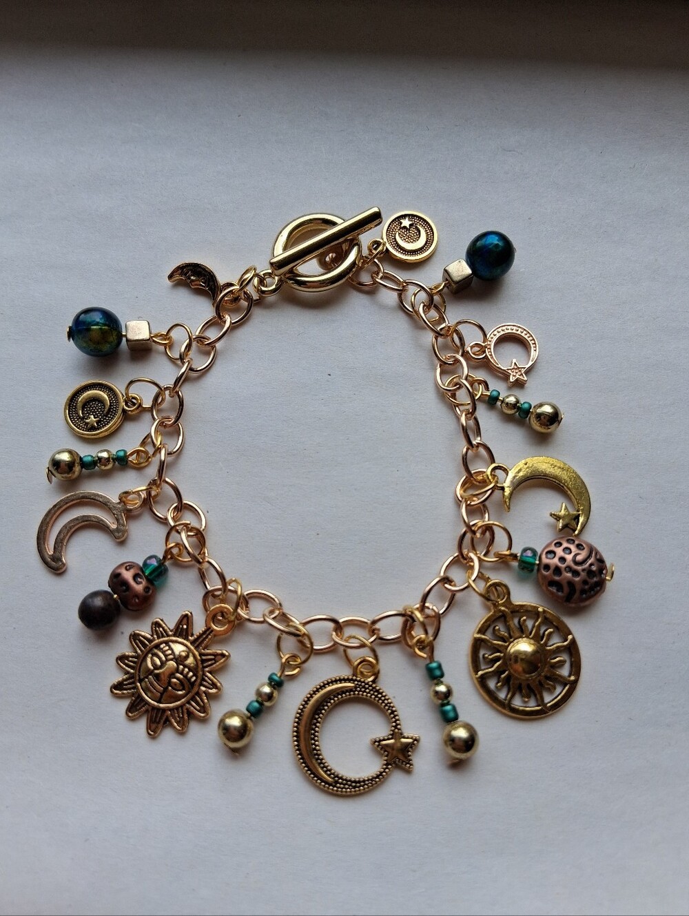 Hand Crafted Gold-Tone Celestial Charm Bracelet with Teal Beads